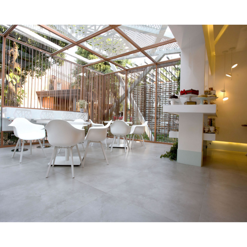 Área gourmet com piso em porcelanato  concreto aparente marca Decortiles